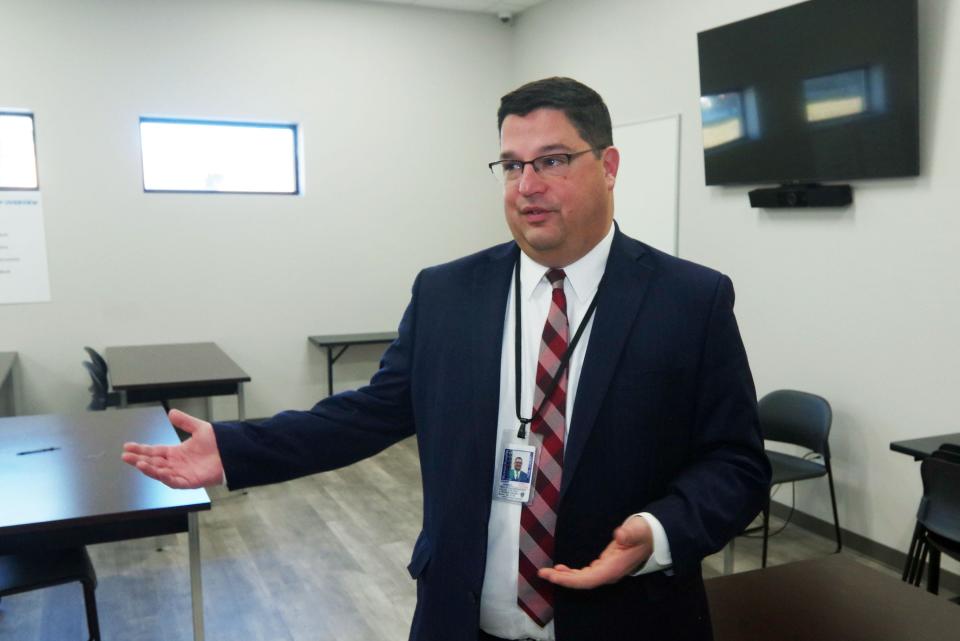 Vincent Lorenti, director of community corrections at the Massachusetts Probation Service, talks from a classroom at the Brockton Community Justice Support Center on Tuesday, Dec. 13, 2022, about how places like the support center can make communities safer.