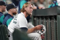 Seattle Mariners pitcher Drew Steckenrider sits in the dugout after he was pulled during the ninth inning of a baseball game against the Texas Rangers, Thursday, April 21, 2022, in Seattle. The Rangers won 8-6. (AP Photo/Ted S. Warren)