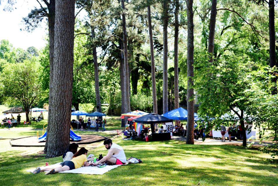 People enjoy the sun during the Pride in the Park event Sunday morning, April 30, 2023, at Columbia Park. 