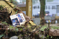 <p>Family photos rest among debris after flash flooding in Ellicott City, Md., Monday, May 28, 2018. Sunday’s destructive flooding left the former mill town heartbroken as it had bounded back from another destructive storm less than two years ago. (Photo: David McFadden/AP) </p>