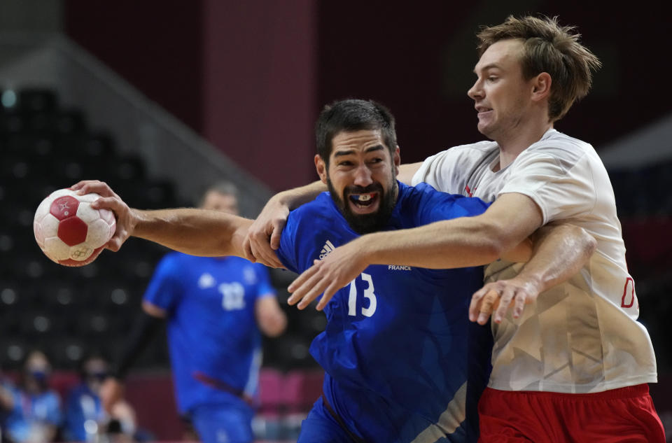 France's Nikola Karabatic makes a shot during the men's gold medal handball match between France and Denmark at the 2020 Summer Olympics, Saturday, Aug. 7, 2021, in Tokyo, Japan. (AP Photo/Sergei Grits)