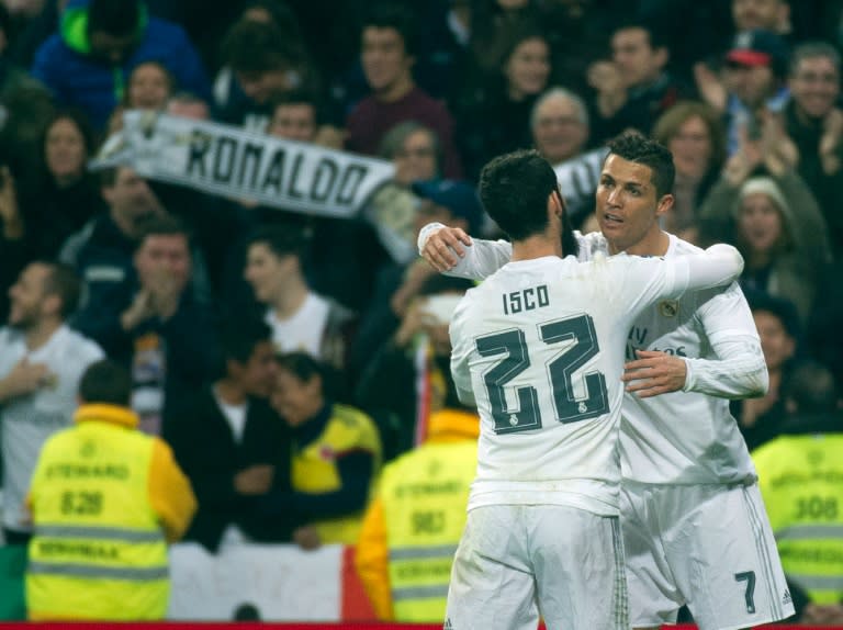 Real Madrid's Cristiano Ronaldo (R) celebrates scoring a goal with teammate Isco during their Spanish La Liga match against Espanyol, at the Santiago Bernabeu stadium in Madrid, on January 31, 2016