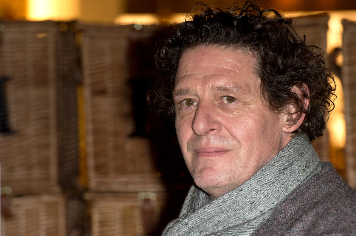 Marco Pierre White signs copies of the 25th anniversary edition of his classic book, "White Heat 25" at Fortnum & Mason in London. (Photo by Zak Hussein/Corbis via Getty Images)
