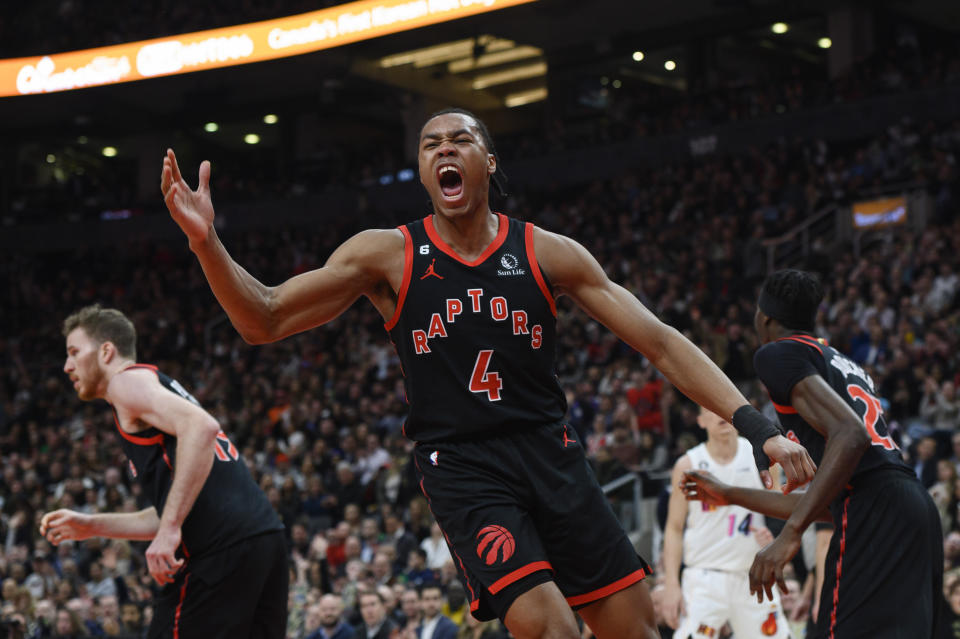 Toronto Raptors forward Scottie Barnes (4) reacts after scoring against the Miami Heat during the first half of an NBA basketball game Tuesday, March 28, 2023, in Toronto. (Christopher Katsarov/The Canadian Press via AP)