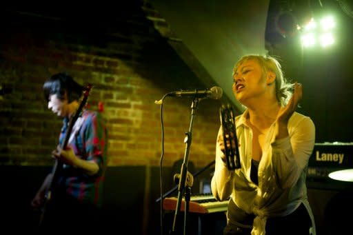 Singer Helen Feng (R) of the band Nova Heart performs at the 2Kolegas live music venue in Beijing. After decades struggling with official censorship, China's contemporary music scene is finally taking off, fuelled by live shows, the Internet and a government eager to cash in on a growing market