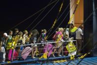 <p>Tourists board a ferry early morning in Ischia, on Aug. 22, 2017, after an earthquake hit the popular Italian tourist island off the coast of Naples, causing several buildings to collapse overnight. (Photo: Eliano Imperato/AFP/Getty Images) </p>