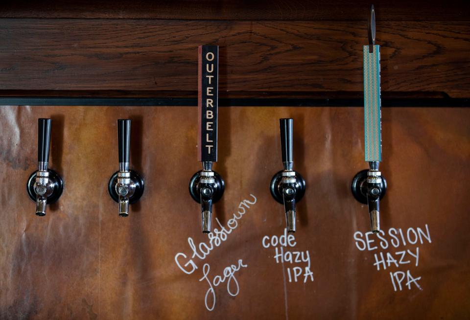 Bar taps on the bar inside of the REMAX APEX Real Estate Building on Nov. 21, 2022 in Lithopolis, Ohio. The building dates back to 1810.