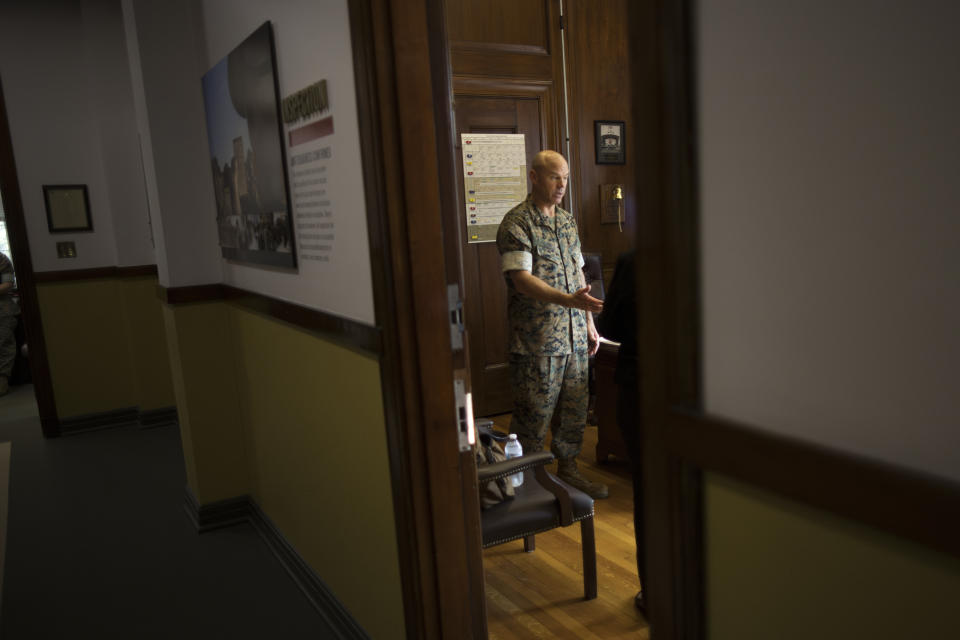 U.S. Marine Brig. Gen. Walker Field speaks with members of his staff in Barrow Hall, the Headquarters Building at the Marine Corps Recruit Depot, Wednesday, June 28, 2023, in Parris Island, S.C. (AP Photo/Stephen B. Morton)