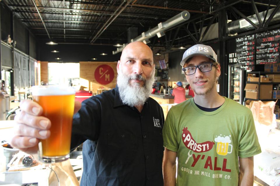 From left, Shawn Childress, brewmaster and co-founder of Cooper and Mill Brewing Company, and his son and brewer, Asher Childress, gear up for Oktoberfest.