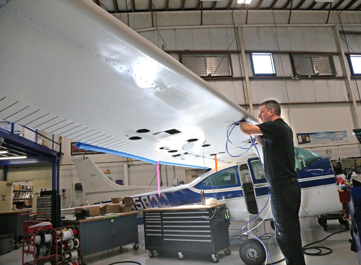 Alec Jordan works on a 1975 Cesna and rebuilds it after a "total gut job" in one of the hangars at Port City Air March 22, 2024.