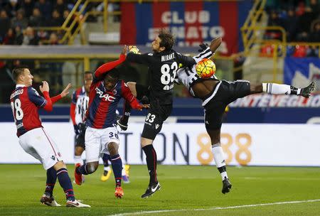 Football Soccer - Bologna v Juventus - Italian Serie A - Renato Dall'Ara Stadium, Bologna, Italy - 19/02/16 Juventus' Paul Pogda jumps for the ball against Bologna's goalkeeper Antonio Mirante (2nd to L). REUTERS/Stefano Rellandini