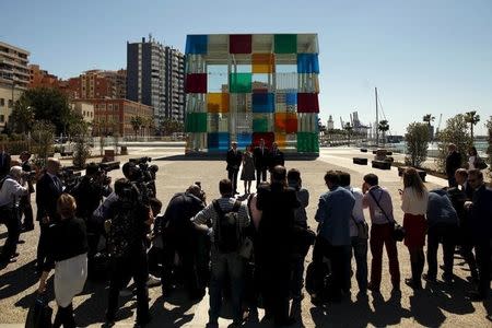 (L-R) Malaga's Mayor Francisco de la Torre, French Culture Minister Fleur Pellerin, Spain's Prime Minister Mariano Rajoy and Centre Pompidou President Alain Seban pose for photographers in front of the Cube, outside the new Malaga branch of the Centre Pompidou after its inauguration in Malaga, southern Spain March 28, 2015. REUTERS/Jon Nazca