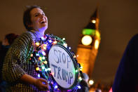 <p>A protester holds up a placard during a rally against U.S. President Donald Trump, Feb. 20, 2017, in London. (Photo: Dominic Lipinski/PA Images via Getty Images) </p>