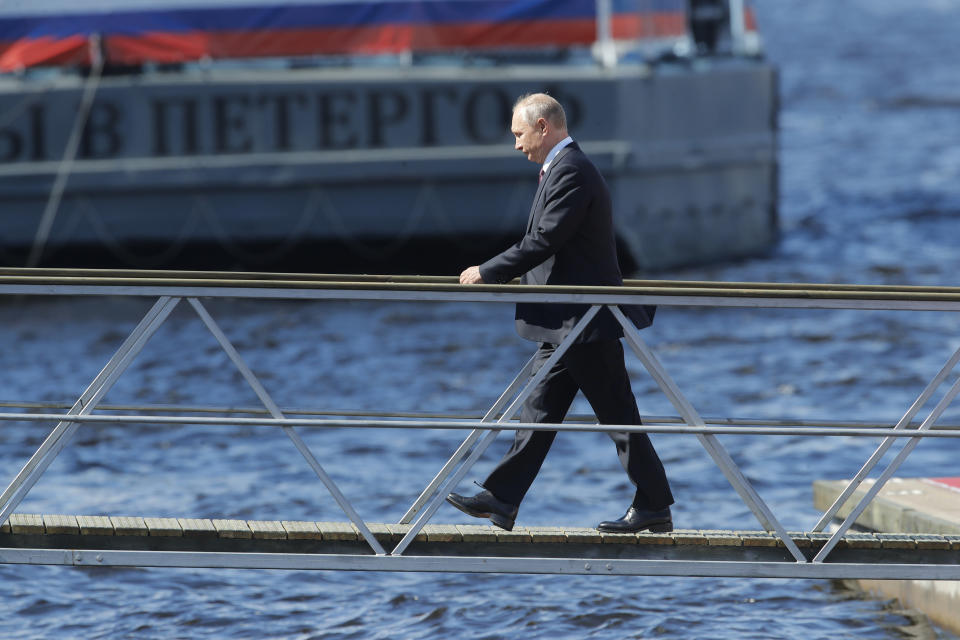 Russian President Vladimir Putin arrives to attend the military parade during the Navy Day celebration in St.Petersburg, Russia, Sunday, July 26, 2020.(AP Photo/Dmitri Lovetsky, Pool)