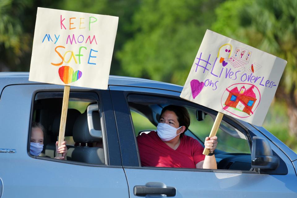 Story Collins and her mother protest at Duval County school board meeting on July 14, against in-person plans for the upcoming school year with COVID-19 infections surging