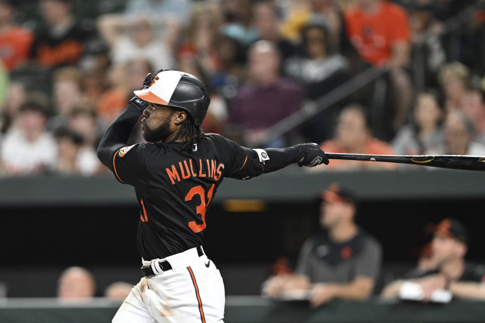 Baltimore Orioles' Cedric Mullins follows through on a three-run home run against the Pittsburgh Pirates in the eighth inning of a baseball game, Friday, May 12, 2023, in Baltimore. (AP Photo/Gail Burton)