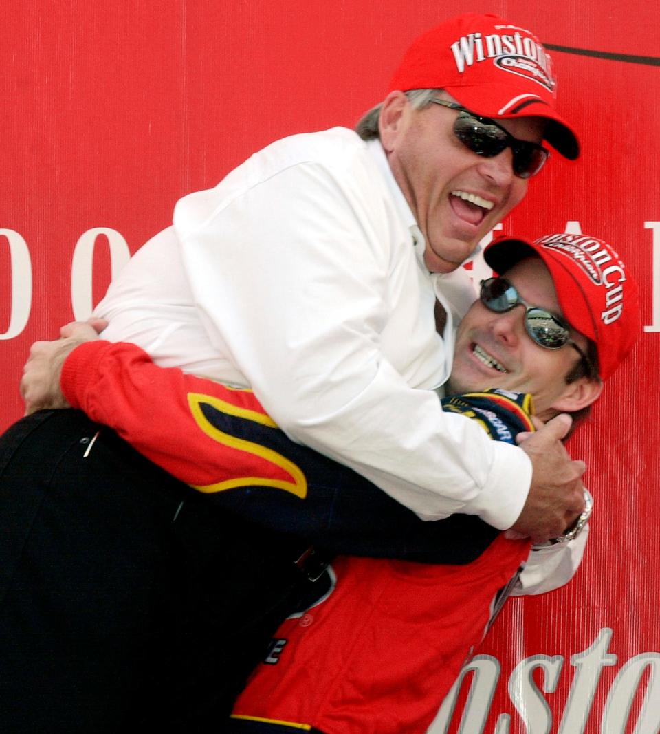 Winston Cup Champion Jeff Gordon, right, picks up car owner Rick Hendrick, left, in Victory Lane after winning the Winston Cup at the NAPA 500 at Atlanta Motor Speedway in Hampton, Ga., on Sunday, Nov. 18, 2001.