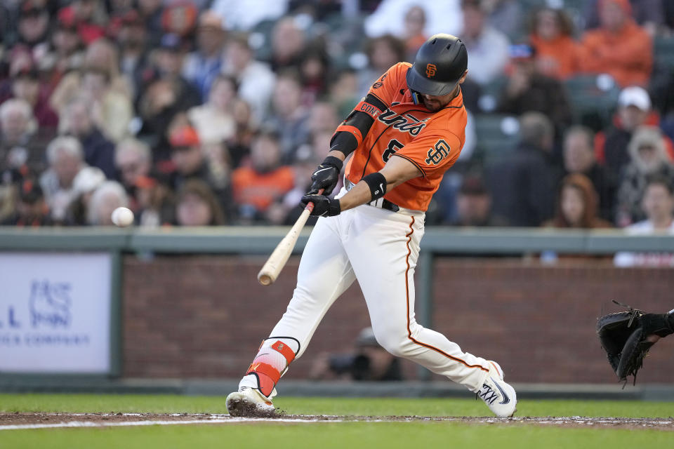 San Francisco Giants' Michael Conforto hits a two-run double against the Arizona Diamondbacks during the third inning of a baseball game in San Francisco, Friday, June 23, 2023. (AP Photo/Tony Avelar)