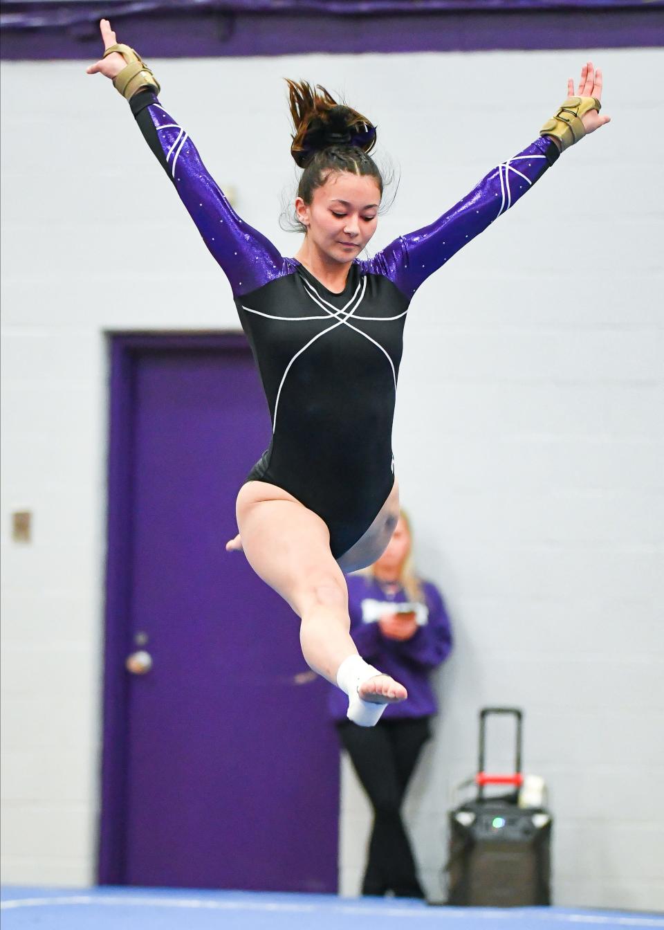 Bloomington South’s Maddie Kawanishi performs her floor routine during the gymnastics meet against Bloomington North and Edgewood at South on Monday, Jan. 8, 2024.