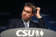 File - In this Monday, Oct. 15, 2018 file photo Bavarian governor Markus Soeder listens during a press conference at the headquarters of the Christian Social Union, CSU, in Munich. German Chancellor Angela Merkel's center-right party, the Christian Democratic Union, CDU, is choosing a new leader on the weekend Saturday Jan. 16 and Sunday Jan. 17, 2021, a decision that will help determine who succeeds Merkel at the helm of the European Union's biggest economy after a 16-year reign. (AP Photo/Matthias Schrader, file)