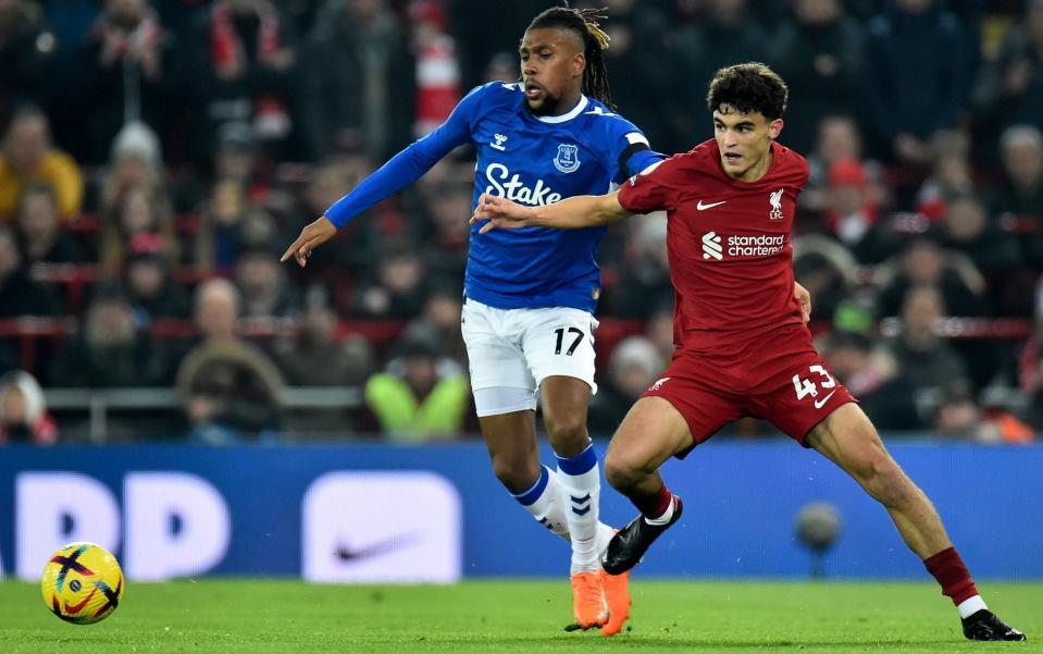 Stefan Bajcetic of Liverpool in action against Alex Iwobi of Everton during the English Premier League soccer match between Liverpool FC and Everton FC - Peter Powell/Shutterstock 