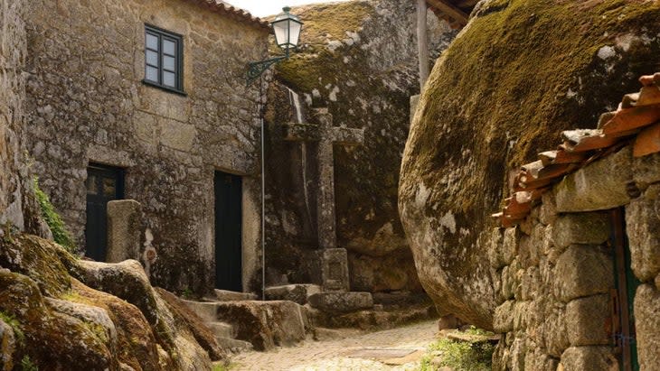 <span class="article__caption">Take a day tour of Monsanto, Portugal, where houses are built around giant boulders, as filmed in <em>House of the Dragon. </em></span>(Photo: Courtesy Civitatis Tours)