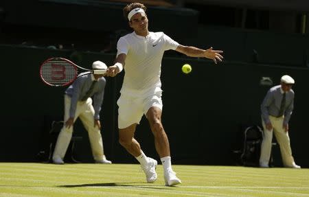 Roger Federer of Switzerland hits a shot during his match against Damir Dzumhur of Bosnia and Herzegovina at the Wimbledon Tennis Championships in London, June 30, 2015. REUTERS/Henry Browne