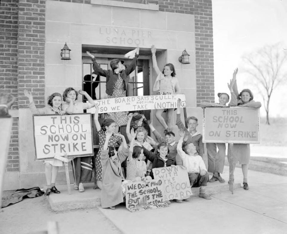 This is a photo of the Luna Pier School strike. In early May of 1937, 100 students went on strike for eight days, petitioning the removal of Miss Mildred Scully as principal for dismissing popular high school teacher James Sheridan.