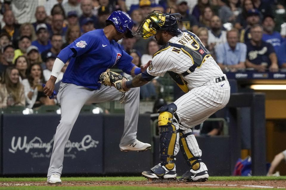 Milwaukee Brewers catcher Omar Narvaez tags out Chicago Cubs' Sergio Alcantara at home during the fourth inning of a baseball game Friday, Sept. 17, 2021, in Milwaukee. Alcantara tried to score from third on a ball hit by Zach Davies. (AP Photo/Morry Gash)