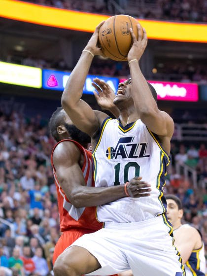 Jazz guard Alec Burks goes to the bucket against Rockets guard James Harden on Wednesday night. (USA TODAY Sports)