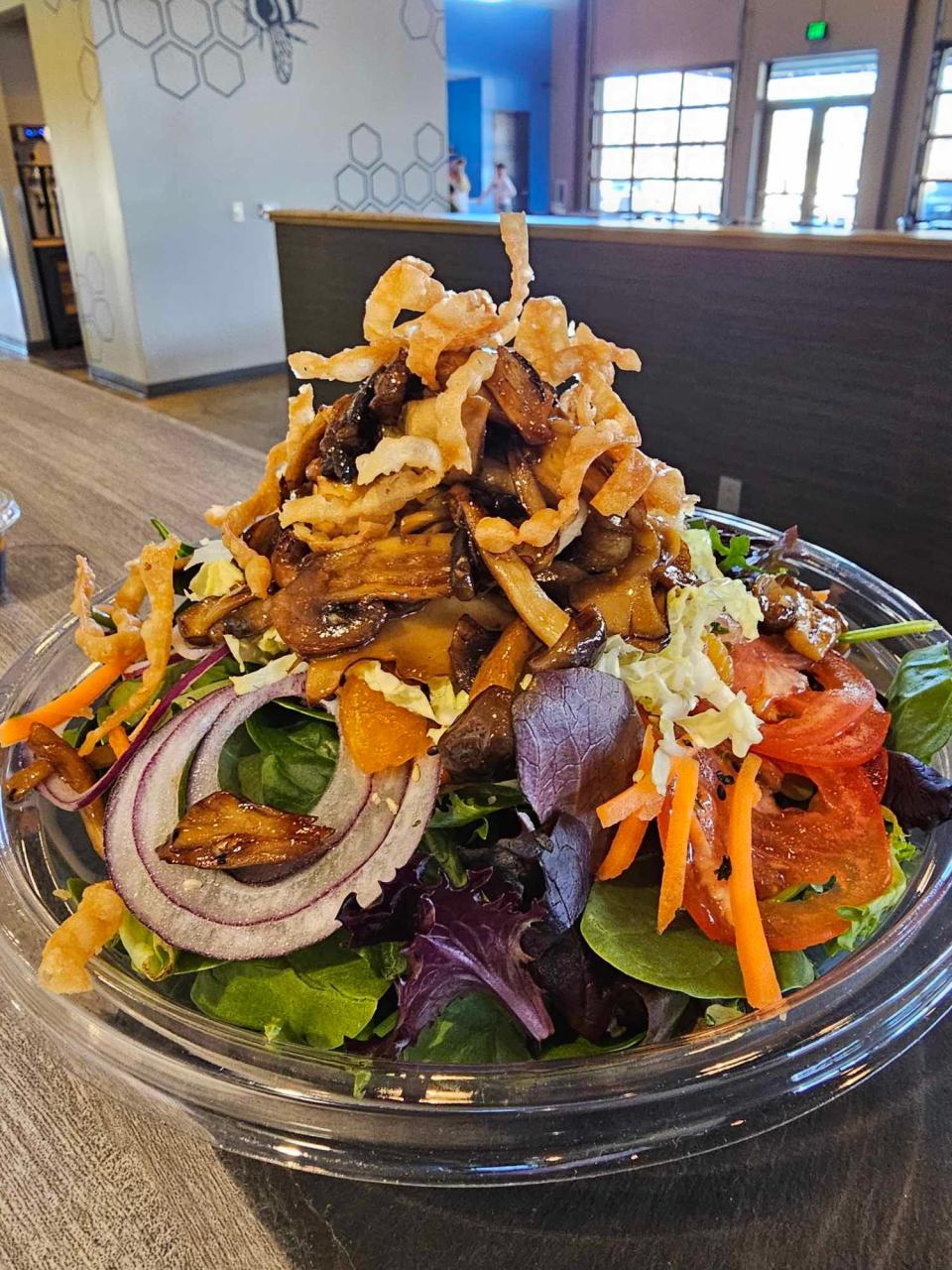 In addition to appetizers, sandwiches and bowls, The Gochu Handcrafted Korean BBQ Bowl at 14 Mill Market, 203 E. Mt. Vernon St. in Nixa, also offers salads. Pictured is the mushroom truffle oil salad, which includes sautéed mushrooms with truffle oil, onion, carrot, tomato, cucumber and fried crispy wontons served over a mixed green salad with soy ginger dressing.