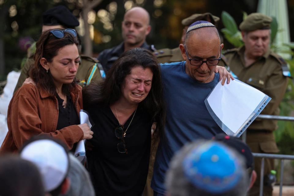 Israelis mourn Ili Bar Sade, a soldier who was killed in an attack by Hamas militants, at his funeral in Tel Aviv, Israel, October 9, 2023. REUTERS/Hadas Parush ISRAEL OUT. NO COMMERCIAL OR EDITORIAL SALES IN ISRAEL NO RESALES. NO ARCHIVES