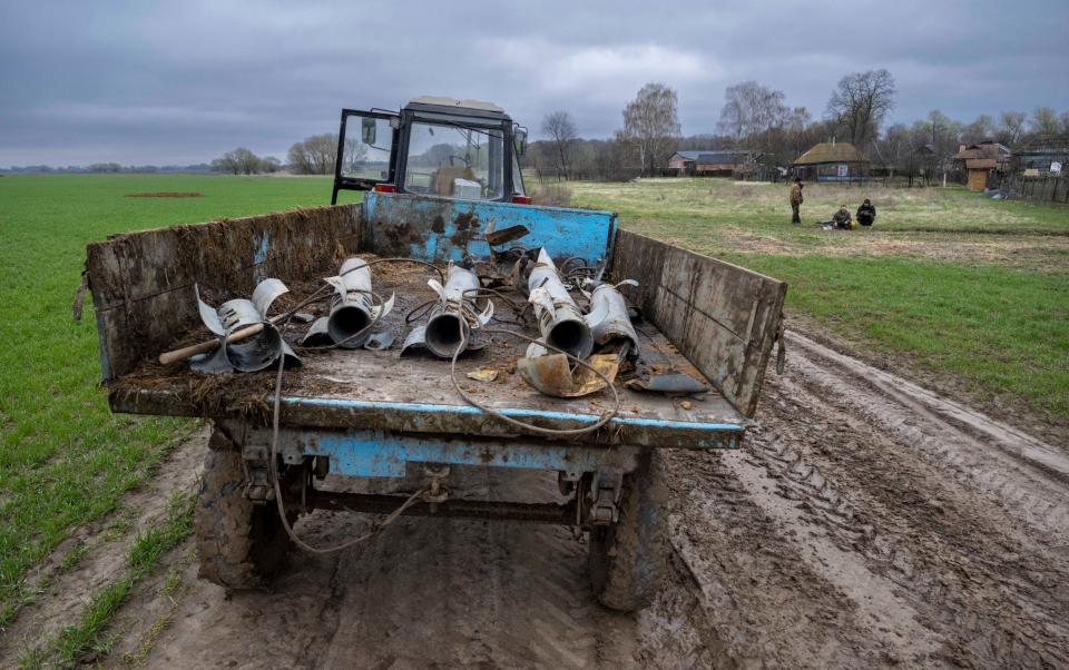  AE Naporivske farm which was attached by Russian forces during the occupation with some of their cattle being slaughtered and Russian soldiers who were based at the local church taking meat to make kebabs. Pic Shows Ordnance collected by the farm workers on the land - Paul Grover/Telegraph