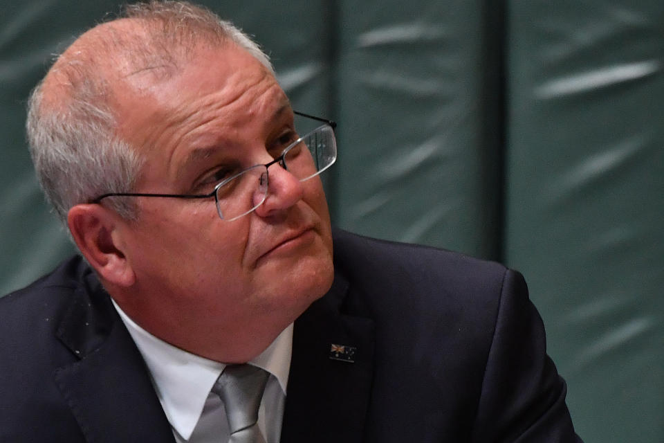 CANBERRA, AUSTRALIA - FEBRUARY 23: Prime Minister Scott Morrison during Question Time in the House of Representatives at Parliament House on February 23, 2021 in Canberra, Australia. Controversial backbencher Craig Kelly has quit the Liberal Party after handing his letter of resignation to Prime Minister Scott Morrison during today's party room meeting. Mr Kelly will sit on the crossbench but will continue to provide supply for the government, meaning he will vote with the government on bills or legislation related to the budget. (Photo by Sam Mooy/Getty Images)