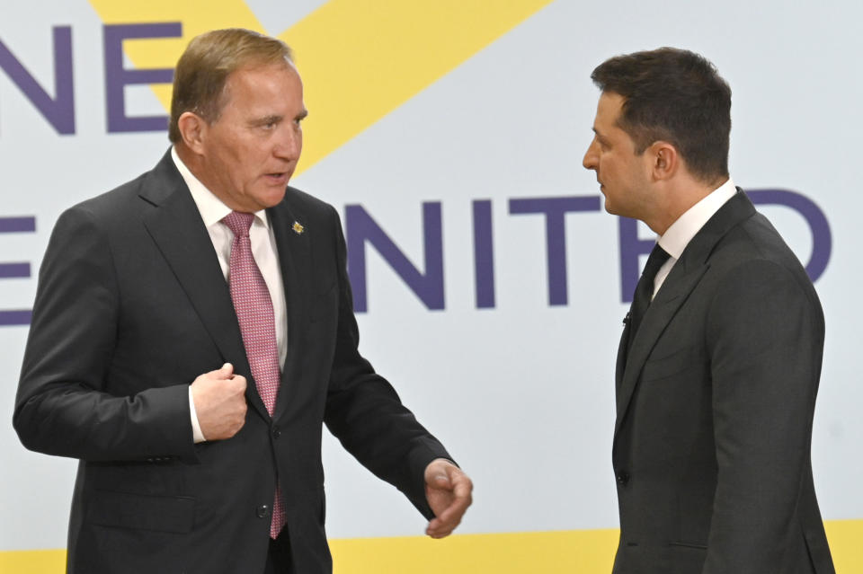 Ukrainian President Volodymyr Zelenskyy, right, and Swedish Prime Minister Stefan Lofven talk during the Crimean Platform Summit in Kyiv, Ukraine, Monday, Aug. 23, 2021. The Crimean Platform, an international summit called by Ukraine to build up pressure on Russia over the annexation that has been denounced as illegal by most of the world, opened in Kyiv on Monday. (Ukrainian Presidential Press Office via AP)