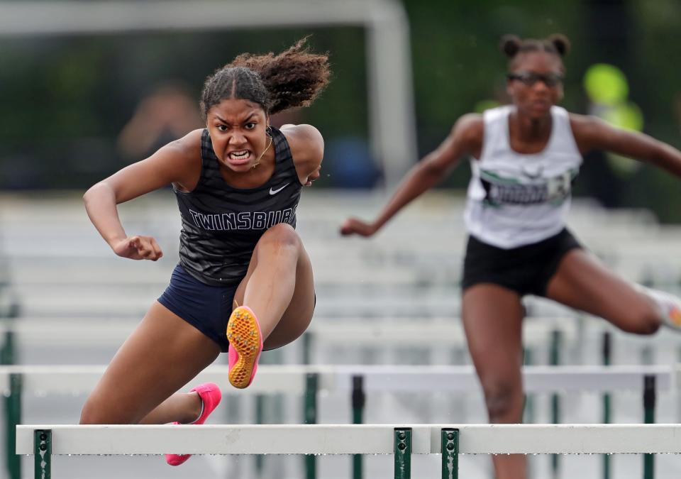 Lia Stewart of Twinsburg clears the final hurdle on her way to a second-place finish in the girls 100 meter hurdles event during the Division I district track meet at Nordonia High School, Friday, May 17, 2024, in Macedonia, Ohio.