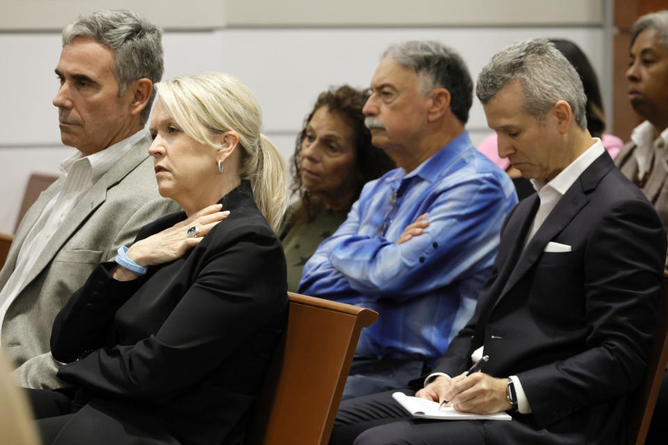 Gena and Tom Hoyer, left, and Max Schachter, right, listen during closing arguments in the trial of former Marjory Stoneman Douglas High School School Resource Officer Scot Peterson, Monday, June 26, 2023, at the Broward County Courthouse in Fort Lauderdale, Fla. Peterson is accused of failing to confront the shooter who murdered 14 students and three staff members at a Parkland high school five years ago. The Hoyer's son, Luke, and Schachter's son, Alex, were killed in the 2018 shootings. (Amy Beth Bennett/South Florida Sun-Sentinel via AP, Pool)