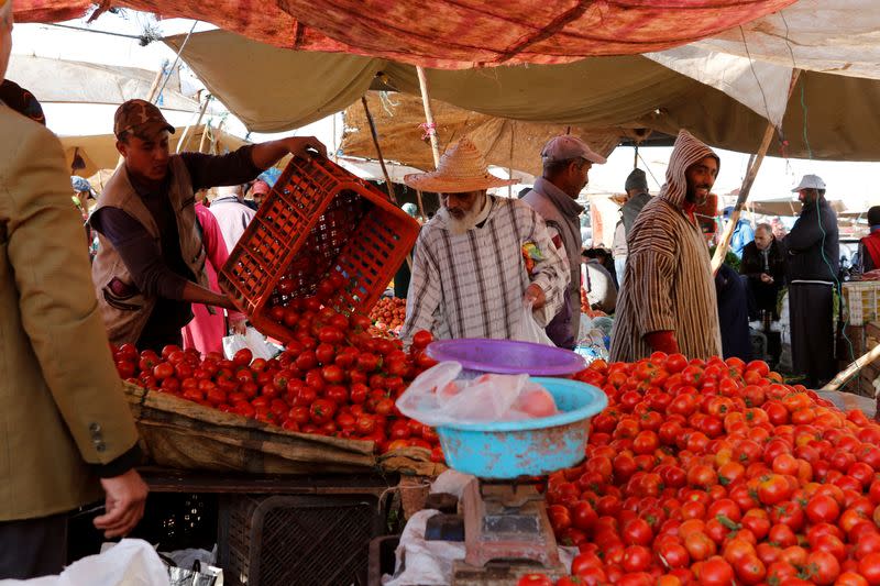 FILE PHOTO: People shop at a vegetable market on the outskirts of Casablanca