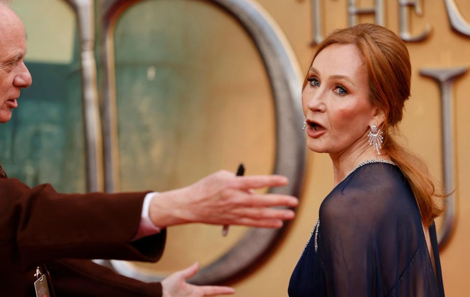 British writer J.K Rowling reacts on the red carpet after arriving to attend the World Premiere of the film 