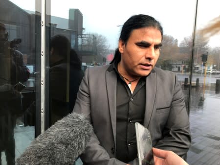 FILE PHOTO: Abdul Aziz, who chased away gunman Brenton Tarrant with an Eftpos machine at Linwood mosque on March 15, speaks to journalists outside the Christchurch High Court in Christchurch