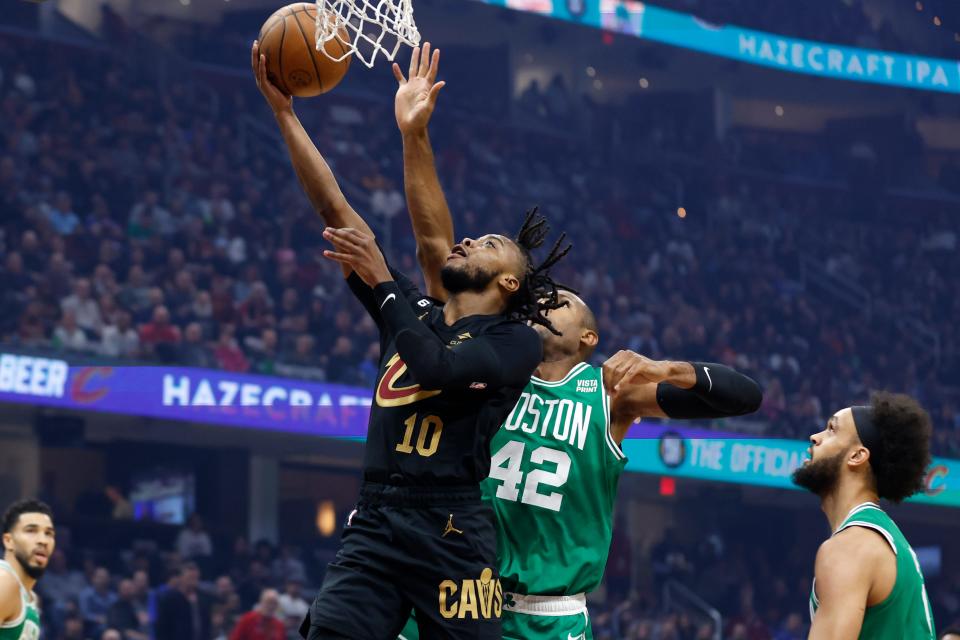 Cleveland Cavaliers guard Darius Garland (10) shoots against Boston Celtics center Al Horford (42) during the first half of an NBA basketball game Wednesday, Nov. 2, 2022, in Cleveland. (AP Photo/Ron Schwane)