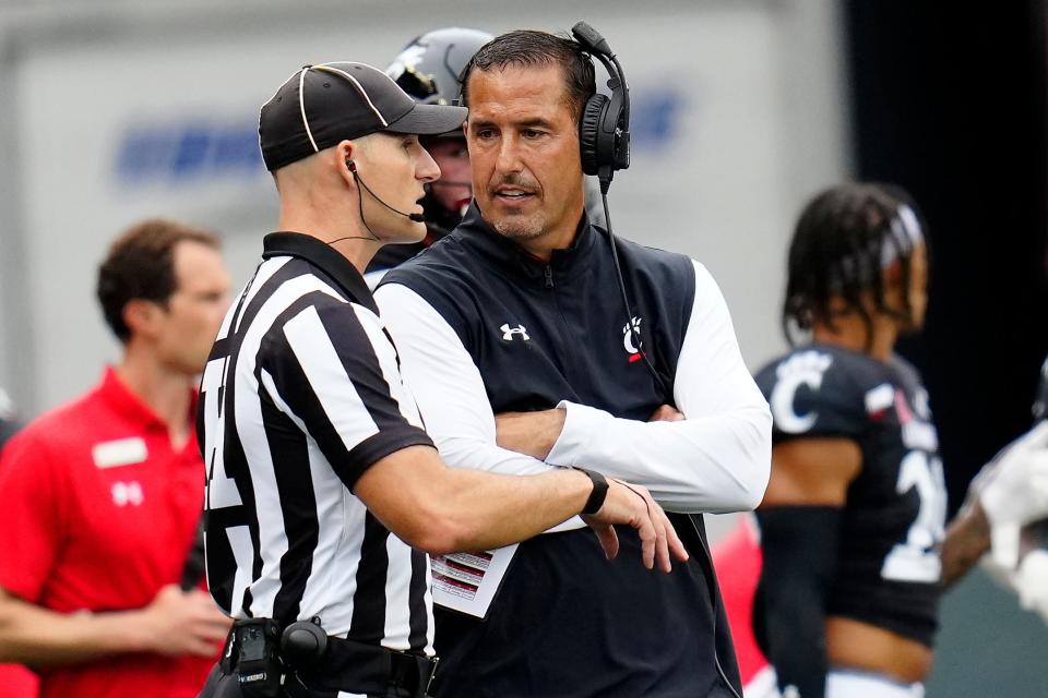 Cincinnati Bearcats head coach Luke Fickell talks with an official in the second quarter of the NCAA football game between the Cincinnati Bearcats and the Kennesaw State Owls at Nippert Stadium in Cincinnati on Saturday, Sept. 10, 2022.