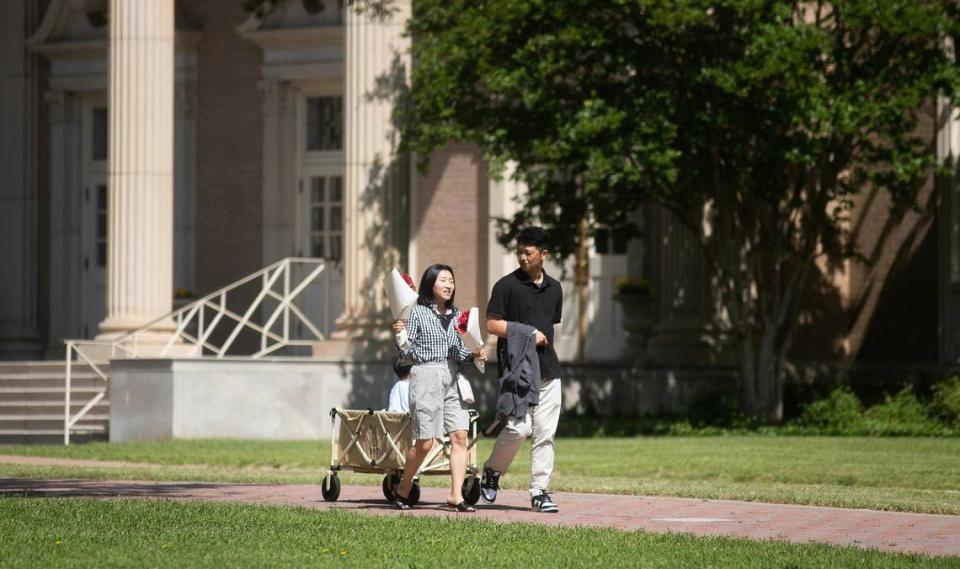 Graduation attendees cross campus to the MacGorman Chapel and Performing Arts Center at Southwestern Baptist Theological Seminary, on Friday, May 5, 2023, in Fort Worth.