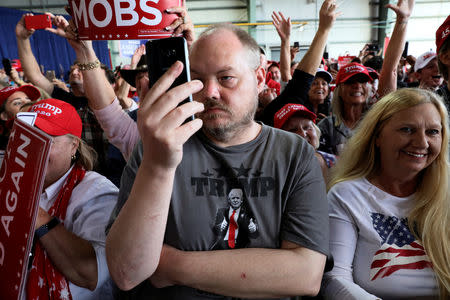 Supporters rally with U.S. President Donald Trump at Middle Georgia Regional Airport in Macon, Georgia, U.S. November 4, 2018. REUTERS/Jonathan Ernst