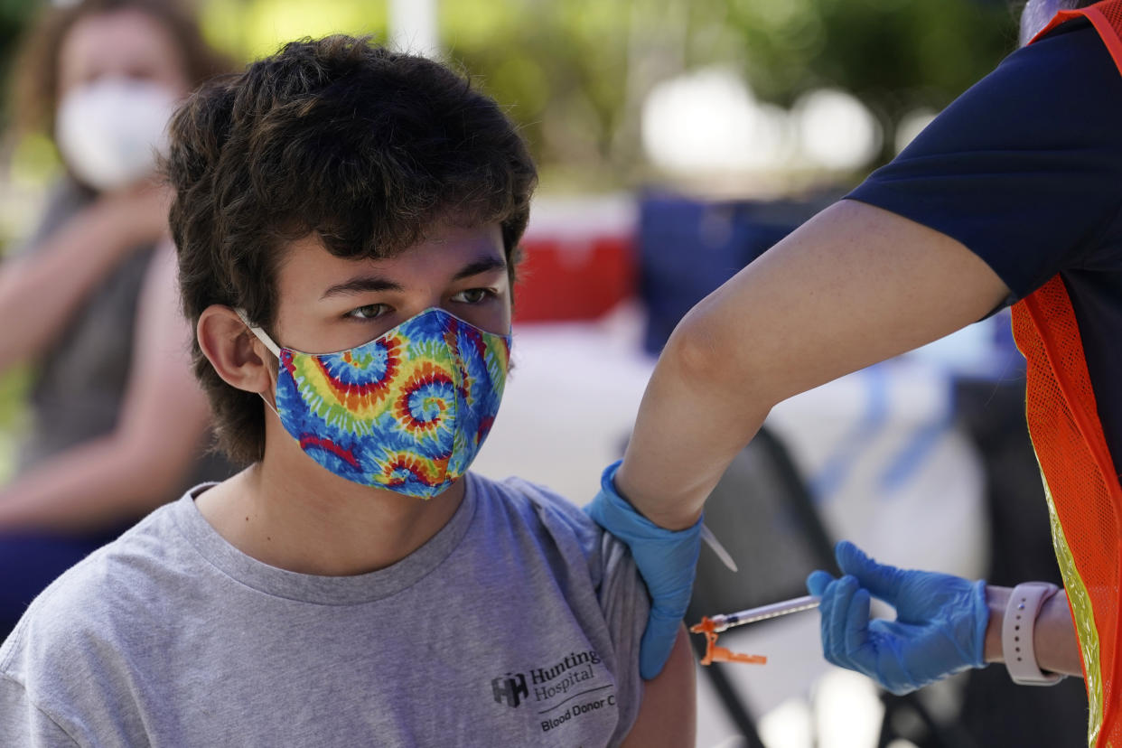 FILE — Finley Martin, 14, gets a shot of the Pfizer COVID-19 vaccine at the First Baptist Church of Pasadena, May 14, 2021, in Pasadena, Calif. A bill that would have allowed teens age 15 and up to get the coronavirus vaccine without parental consent will not pass the Legislature, state Sen. Scott Wiener announced, Wednesday, Aug. 31, 2022. Wiener, the bill's author, said it didn't have enough support to clear the state Assembly. (AP Photo/Marcio Jose Sanchez, File)