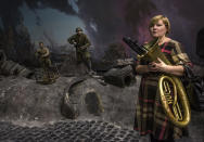 <p>A woman musician stands on the reconstruction of the battle for Berlin during WWII in the Hall of Fame Museum of the Great Patriotic War of 1941-1945 at Poklonnaya Hill in Moscow, Russia, Feb. 19, 2017. (Photo: Sergei Ilnitsky/EPA) </p>