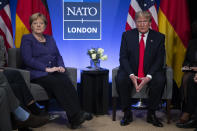 President Donald Trump meets with German Chancellor Angela Merkel during the NATO summit at The Grove, Wednesday, Dec. 4, 2019, in Watford, England. (AP Photo/ Evan Vucci)