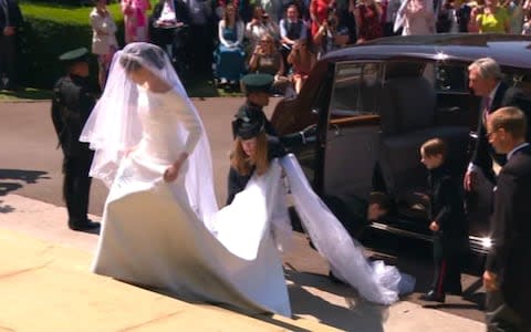 Designer Clare Waight Keller was on hand to make last minute tweaks to Meghan Markle's wedding dress as she arrived at St George's Chapel