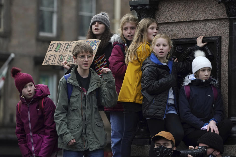 Young climate activists attend a protest in Glasgow, Scotland, Friday, Nov. 5, 2021 which is the host city of the COP26 U.N. Climate Summit. The protest was taking place as leaders and activists from around the world were gathering in Scotland's biggest city for the U.N. climate summit, to lay out their vision for addressing the common challenge of global warming. (AP Photo/Jon Super)