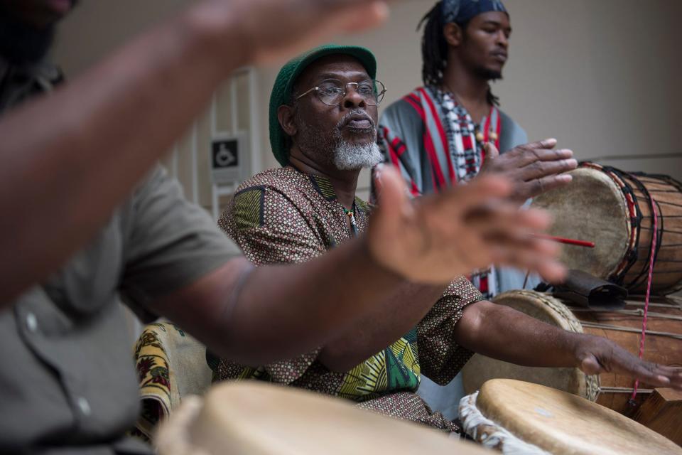 Josh Galemore/Savannah Morning News - Abu Majied (center) drums with Willie Jenkins (left) and Yusuf Major (right) before the Juneteenth Celebration Saturday afternoon at the Jepson Center.
